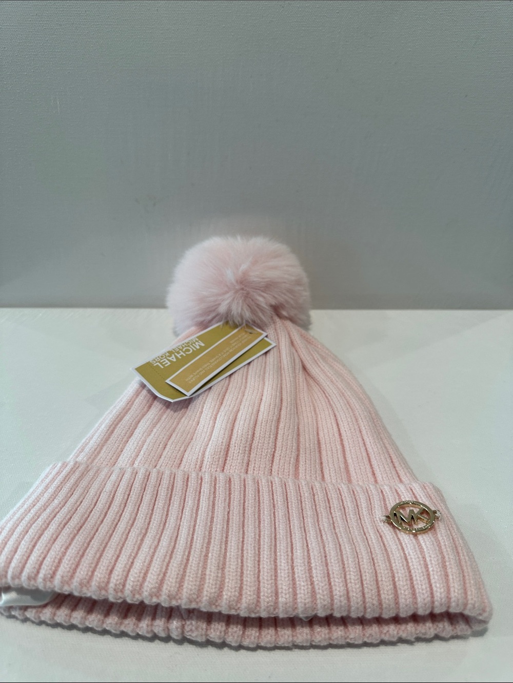 NWT Michael Michael Kors Baby Pink Beanie with Pompom and MK plaque and Satin.